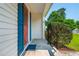 Covered front door entrance with blue shutters, a walkway, and mature bushes at 350 Birch Rill Dr, Alpharetta, GA 30022