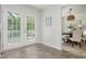 Entryway with double doors leading to the outdoor deck and view of the dining room at 350 Birch Rill Dr, Alpharetta, GA 30022