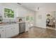 Cozy kitchen with stainless appliances, white cabinets, and access to the deck at 350 Birch Rill Dr, Alpharetta, GA 30022