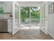 Bright kitchen featuring French doors leading to an outdoor deck at 350 Birch Rill Dr, Alpharetta, GA 30022