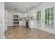 Well-lit kitchen with stainless steel appliances and access to the outdoor deck at 350 Birch Rill Dr, Alpharetta, GA 30022