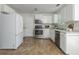 A functional kitchen with stainless steel appliances and white cabinetry at 350 Birch Rill Dr, Alpharetta, GA 30022
