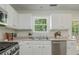 Modern kitchen featuring stainless steel appliances and bright white cabinetry at 350 Birch Rill Dr, Alpharetta, GA 30022