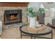 Close-up of the stone fireplace and decor in the living room, creating a warm ambiance at 350 Birch Rill Dr, Alpharetta, GA 30022