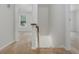 Carpeted staircase landing showcasing neutral walls and bright hallway at 350 Birch Rill Dr, Alpharetta, GA 30022