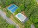 Aerial image shows community tennis courts and a swimming pool surrounded by mature trees at 4197 Chadds Xing, Marietta, GA 30062