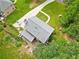 Aerial view of property showcasing its backyard with garden plots, deck, and mature trees at 4197 Chadds Xing, Marietta, GA 30062