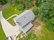 Aerial view of a home showcasing its roof, driveway, and surrounding greenery at 4197 Chadds Xing, Marietta, GA 30062