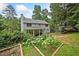 Serene backyard featuring a garden and a view of the house with a covered porch at 4197 Chadds Xing, Marietta, GA 30062