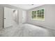 Bedroom with plush gray carpeting, window and hallway, closet, and bedroom door at 4197 Chadds Xing, Marietta, GA 30062