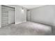 Bedroom with plush carpet, door to hallway, and closet with shelving at 4197 Chadds Xing, Marietta, GA 30062