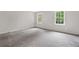 Comfortable bedroom with two windows providing views of the backyard at 4197 Chadds Xing, Marietta, GA 30062