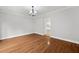 Dining room featuring hardwood floors and views into the kitchen at 4197 Chadds Xing, Marietta, GA 30062