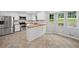 Bright kitchen featuring white cabinets, stainless steel appliances, tile floors, and butcher block countertops at 4197 Chadds Xing, Marietta, GA 30062
