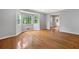 Bright living room with large windows, hardwood floors, and neutral paint at 4197 Chadds Xing, Marietta, GA 30062