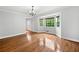 Bright living room with hardwood floors, bay window and decorative chandelier at 4197 Chadds Xing, Marietta, GA 30062