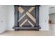 Close up of wood accent wall with black frame, located in a room with fresh drywall at 52 Deer Canyon Dr, Auburn, GA 30011