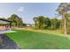 Expansive backyard featuring lush lawn and mature trees, offering a private outdoor space at 52 Deer Canyon Dr, Auburn, GA 30011