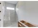 Bathroom with a frameless glass shower and a small window for natural light at 52 Deer Canyon Dr, Auburn, GA 30011