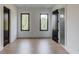 Bedroom with two windows and black doors that lead to other rooms at 52 Deer Canyon Dr, Auburn, GA 30011