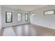 Bright bedroom with hardwood floors and multiple windows offering natural light at 52 Deer Canyon Dr, Auburn, GA 30011