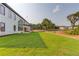 Modern home featuring large windows and a well-manicured lawn, creating a bright and inviting atmosphere at 52 Deer Canyon Dr, Auburn, GA 30011