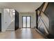Home foyer with staircase, wood accent wall and double door entryway at 52 Deer Canyon Dr, Auburn, GA 30011