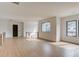 Open living space with wood floors, large windows, and modern railing detail at 52 Deer Canyon Dr, Auburn, GA 30011