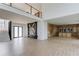 Bright living room with high ceilings, modern fireplace, light wood floors, and large windows at 52 Deer Canyon Dr, Auburn, GA 30011
