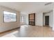 Spacious living room featuring a modern fireplace and large windows for ample natural light at 52 Deer Canyon Dr, Auburn, GA 30011