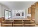 Open concept living room with a modern fireplace and natural light from large windows at 52 Deer Canyon Dr, Auburn, GA 30011