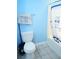 Bathroom with toilet, shower-tub and blue walls with towel at 852 Glynn Oaks Dr, Clarkston, GA 30021