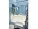 Bathroom highlighting a large bathtub and a mirrored wall at 852 Glynn Oaks Dr, Clarkston, GA 30021