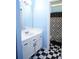 Bathroom featuring black and white checkered flooring and shower with patterned curtain at 852 Glynn Oaks Dr, Clarkston, GA 30021
