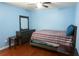 Cozy bedroom with ceiling fan, wood floors, and furniture set at 852 Glynn Oaks Dr, Clarkston, GA 30021