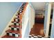 Entryway featuring unique staircase and a glimpse into the living room at 852 Glynn Oaks Dr, Clarkston, GA 30021