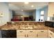 Kitchen sink and countertop overlooking the living room with a fireplace at 852 Glynn Oaks Dr, Clarkston, GA 30021