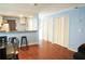 Open living space with hardwood floors, a kitchen view, and plenty of natural light at 852 Glynn Oaks Dr, Clarkston, GA 30021