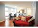 Inviting living room with hardwood floors, view into kitchen, and dining area at 852 Glynn Oaks Dr, Clarkston, GA 30021