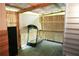 Enclosed patio with a weathered wooden floor and a treadmill, surrounded by a slatted wood fence at 852 Glynn Oaks Dr, Clarkston, GA 30021