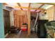 Enclosed patio space featuring wood ceiling and wooden flooring, with storage and fitness equipment at 852 Glynn Oaks Dr, Clarkston, GA 30021