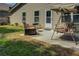 Cozy back patio features a swing, outdoor chair, and grill at 110 Baltusrol Way, Covington, GA 30014