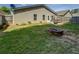 Enjoy the backyard with a fire pit and patio sitting area at 110 Baltusrol Way, Covington, GA 30014