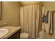Bathroom featuring a shower with beige tiling and shower curtain at 110 Baltusrol Way, Covington, GA 30014