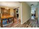 Dining room with rustic wood floors, wooden table, and a stylish sliding barn door to the kitchen at 110 Baltusrol Way, Covington, GA 30014