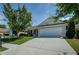 Residential home boasting a wide driveway and beautifully maintained lawn at 110 Baltusrol Way, Covington, GA 30014