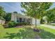 Charming home with a well-manicured lawn and mature trees at 110 Baltusrol Way, Covington, GA 30014