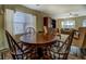 Bright living area boasts hardwood floors, a cozy feel, and a dining table at 110 Baltusrol Way, Covington, GA 30014