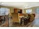 Open-concept living area features dining space, a wood entertainment center, and cozy seating at 110 Baltusrol Way, Covington, GA 30014