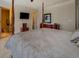 Well-lit bedroom featuring a four-poster bed and dark wood furniture at 110 Baltusrol Way, Covington, GA 30014